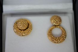 A pair of modern Italian 9ct gold earrings in the form of floral hoops and round bosses,