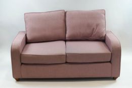 A Willow and Hall two seat sofa in pale pink upholstery,