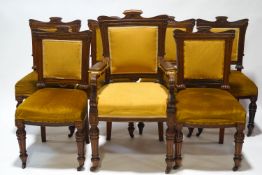 A set of seven Victorian dining chairs with mahogany show frame on turned fluted and reeded legs,