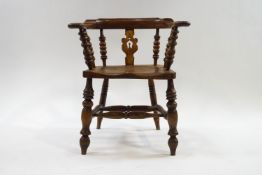 A Victorian smokers bow chair with elm seat,