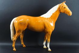 A large Beswick Palomino horse, printed factory marks, 30cm tall,