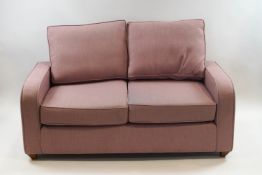 A Willow and Hall two seat sofa in pale pink upholstery,