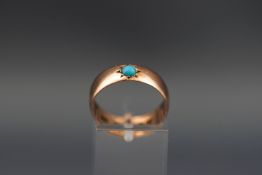A 9ct rose gold wedding band, later star-gypsy set with a small round cabochon turquoise, ring,