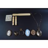 A collection of jewellery and objects, including an oval shell cameo,