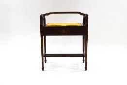 An Edwardian inlaid mahogany piano stool with lift up lid,