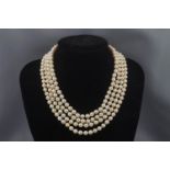 A cultured pearl four row necklace, the uniform beads approx. 6.5-7.