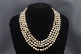 A cultured pearl four row necklace, the uniform beads approx. 6.5-7.
