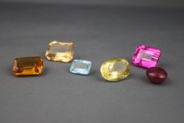 A collection of six loose gem stones,