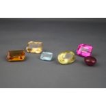 A collection of six loose gem stones,