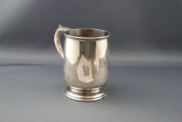 A silver half-pint mug on foot,