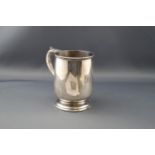 A silver half-pint mug on foot,