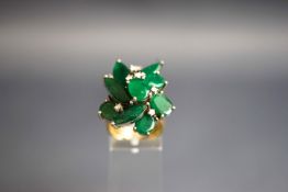 An emerald and diamond abstract cluster ring,