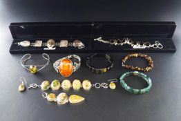 A collection of miscellaneous white metal and gem set jewellery including a rutilated-quartz five