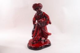 A Flambe Royal Doulton figure 'The Lamp Seller' HN3278