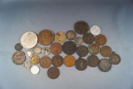 A small group of interesting coins and a few tokens,