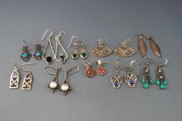 Ten pairs of silver or white metal and gem-set pendent earrings,