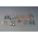 Ten pairs of silver or white metal and gem-set pendent earrings,