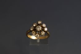 A diamond cluster ring, the nine round brilliants approx. 1.