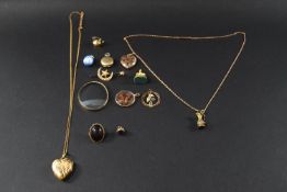 A collection of charms, seals, pendants, lockets and a seed pearl brooch, some items possibly gold.