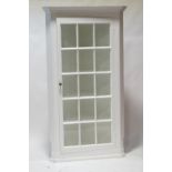 A large painted pine corner cabinet with astragal glazed doors,