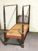 A Victorian child's mahogany four poster bed, with some replacement supports, takes a 2' 6"mattress,