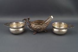 Two silver small quaiches, each with a floral scroll pierced flat handle,