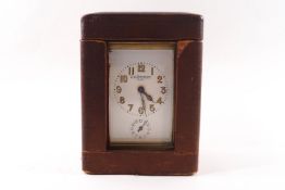 A French brass alarm carriage clock, the painted enamel dial signed A La Renaissance, Paris, 14.