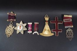 Four Masonic medals including two silver gilt and enamel examples, one as a square and compass,