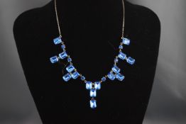 A blue and colourless paste necklace,