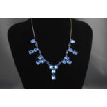 A blue and colourless paste necklace,