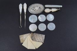 A small quantity of Chinese round mother of pearl gaming counters,