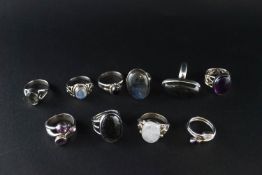 A collection of ten white metal and gem set rings, set with various stones including labradorite.