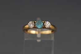 A 9ct gold, blue and white zircon three stone ring, post 2000 convention hallmarks, size N1/2, 2.