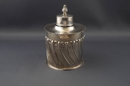 A late Victorian silver cylindrical tea caddy,