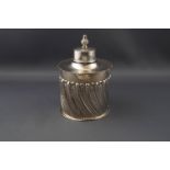 A late Victorian silver cylindrical tea caddy,