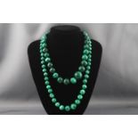 Two malachite bead necklaces, one the beads graduated approx. 20.0mm - 9.