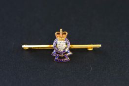 Royal Army Ordnance Corps, a 9ct gold and polychrome enamel regimental badge bar brooch,