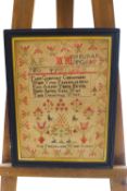 A Victorian pictorial needlework sampler, illustrating the alphabet, a religious verse,