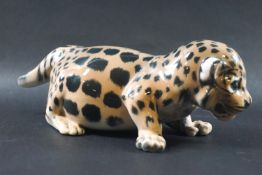 A Royal Copenhagen figure of a leopard cub, printed and painted factory marks,