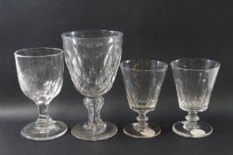 An early 19th century cut glass of large proportions with faceted bowl and stem on flared foot, 17.