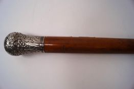 A Victorian silver topped walking cane,