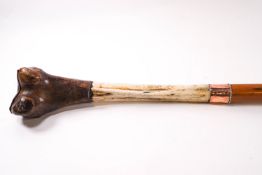 An unusual walking stick, being the tibia from a Tibetan Saint,