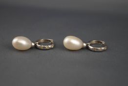 A pair of diamond hoop and cultured freshwater pearl drop earrings,