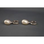 A pair of diamond hoop and cultured freshwater pearl drop earrings,