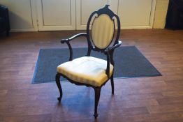 An Edwardian carved mahogany framed cameo back open arm occasional chair,