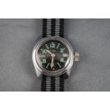 Chilex, a vintage stainless steel round wrist watch,