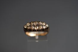 An early 20th century diamond boat-shaped cluster ring, the 12 old-cut stones approx. 1.