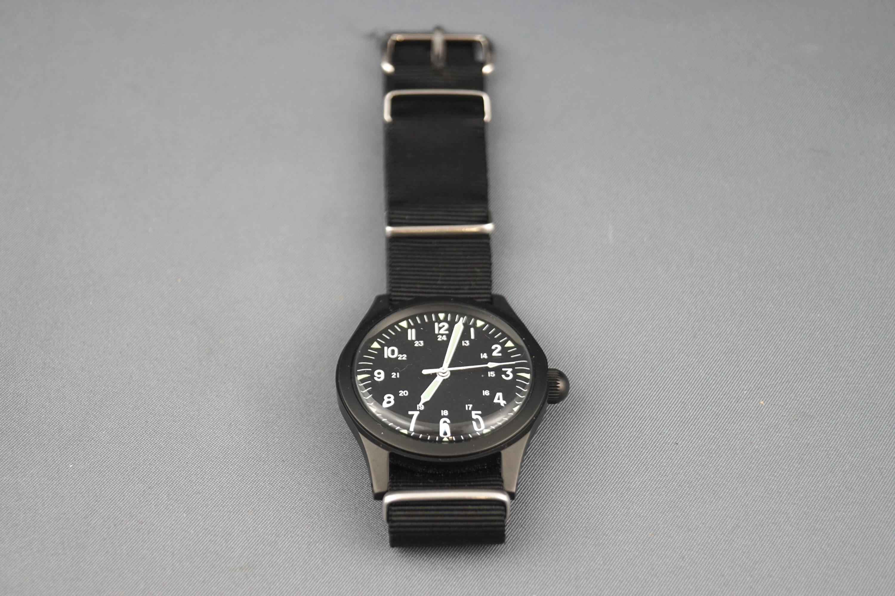 M W C, a replica US Army, Type A 1943 military wrist watch, black dial with white Arabic numerals, - Image 2 of 2