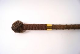 A 19th century Bosun's rope covered stick