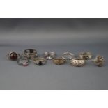 Ten various silver or white metal rings including a mystic quartz solitaire ring,